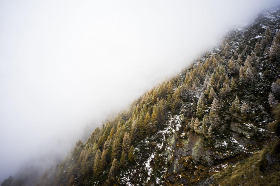Free Image of Snowboarder Descending Snowy Mountain 