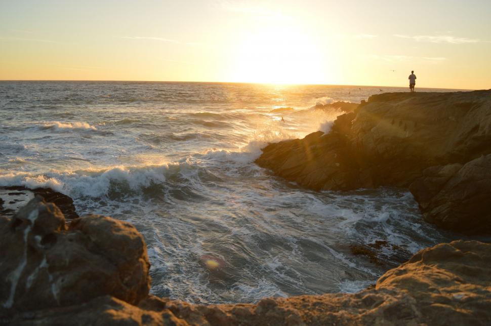 Free Image of Person Standing on Cliff by the Ocean 