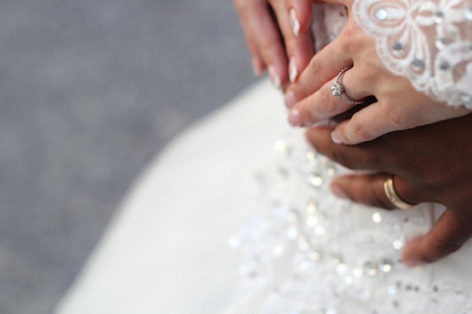 Free Image of Close Up of Two People Holding Hands 