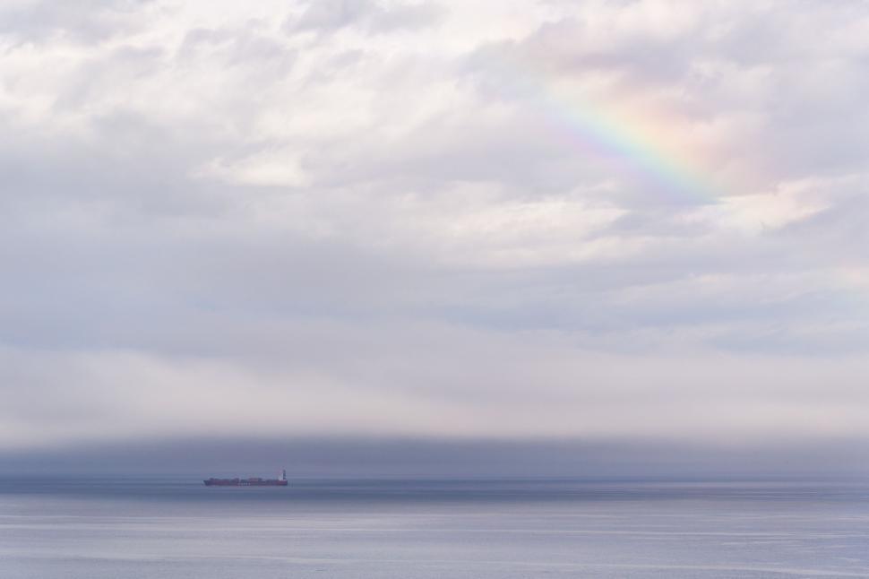 Free Image of Vast Water Body Beneath Overcast Sky 