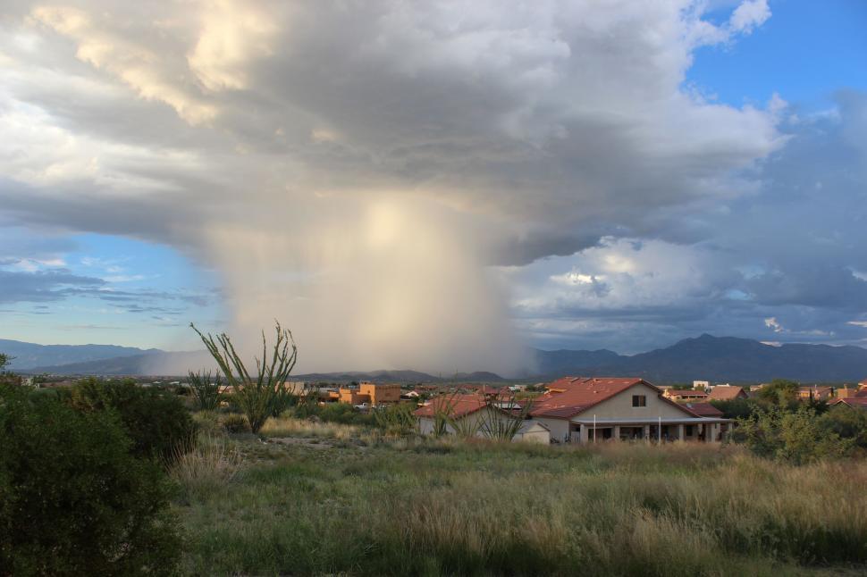 Free Image of Massive Cloud Looms Over Small Town 