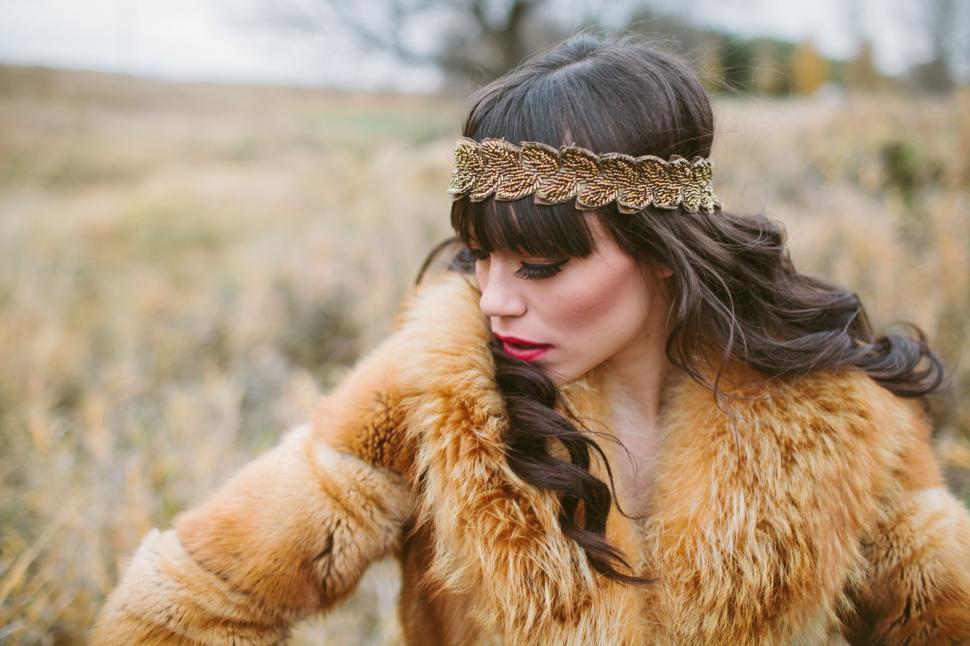 Free Image of Woman in Fur Coat Standing in Field 
