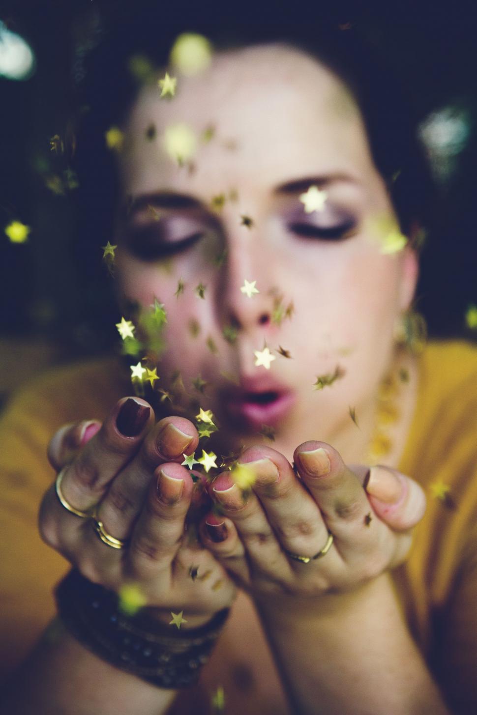 Free Image of Woman Holding a Star in Her Hands 