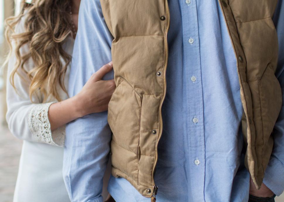 Free Image of Man and Woman Walking Down a Street 