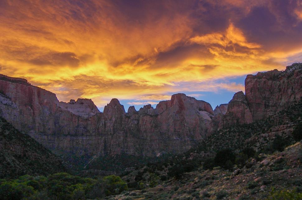 Free Image of Majestic Sunset Over Mountain Valley 