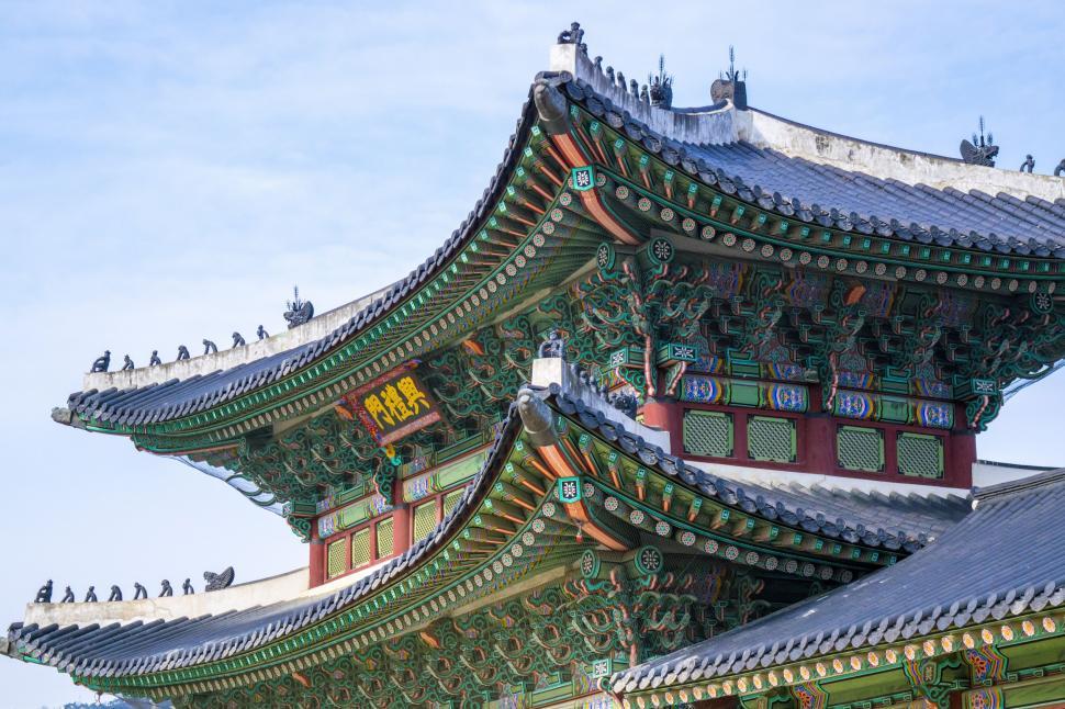 Free Image of Tall Building Covered in Birds 