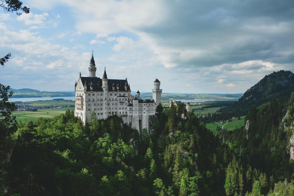 Free Image of Majestic Castle on Lush Green Hillside 
