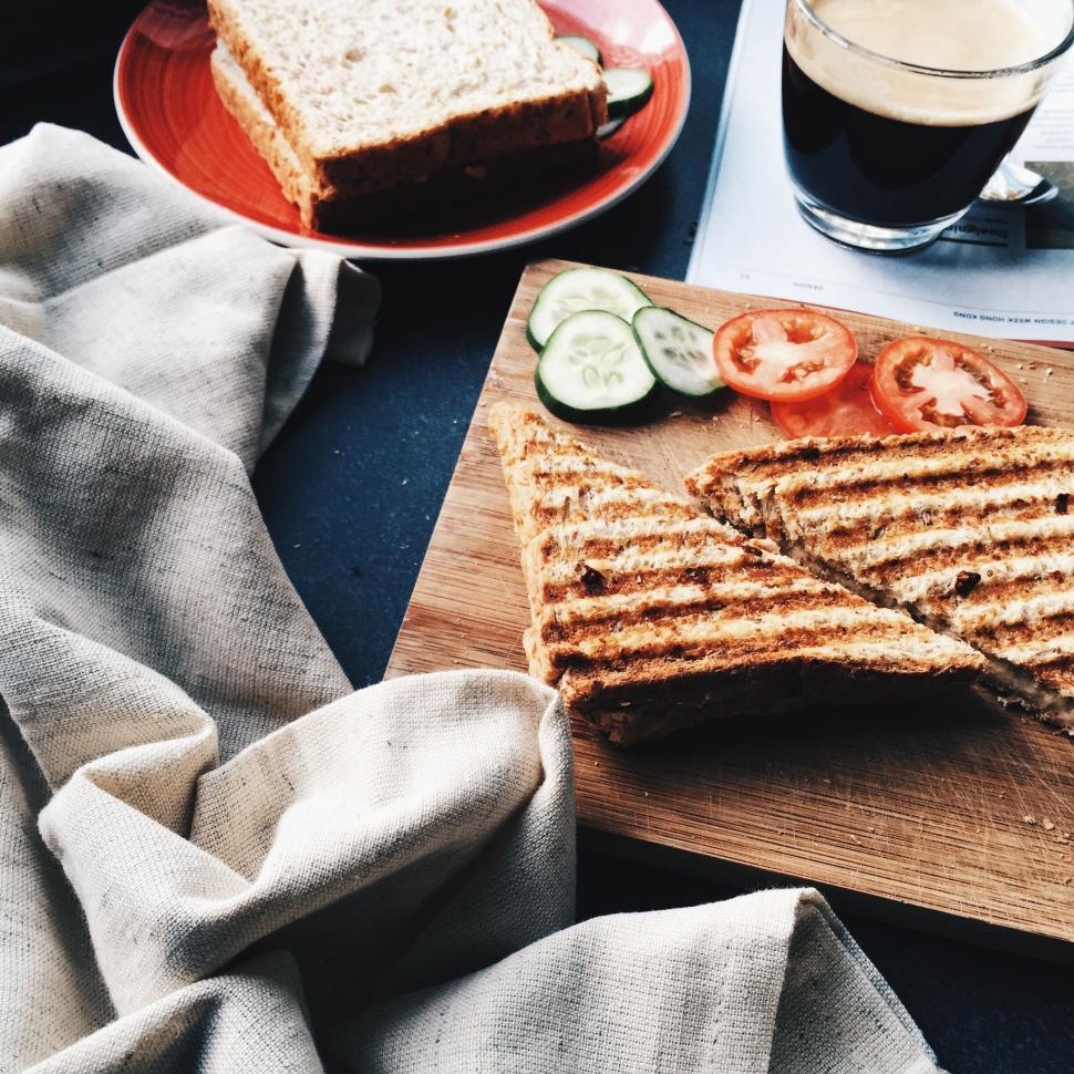 Free Image of Wooden Cutting Board With Cut in Half Sandwich 
