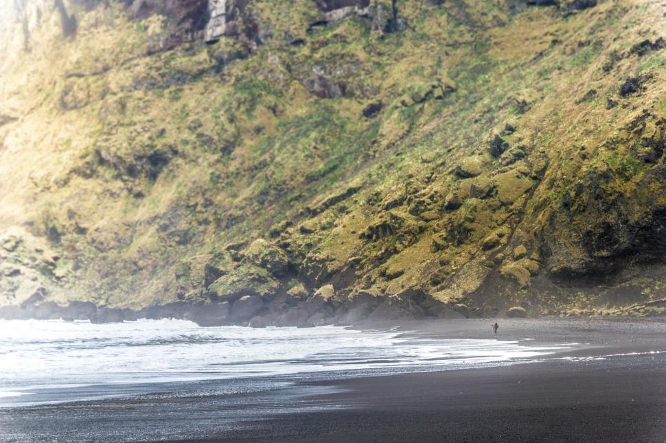 Free Image of Person Walking on Beach With Surfboard 