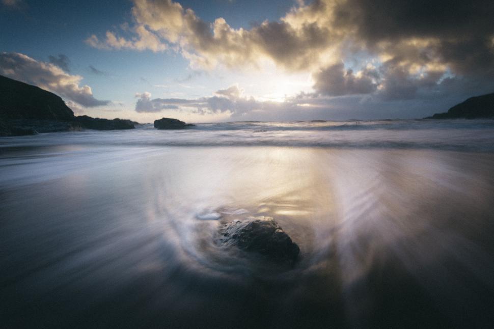 Free Image of Rock in the Middle of a Body of Water 