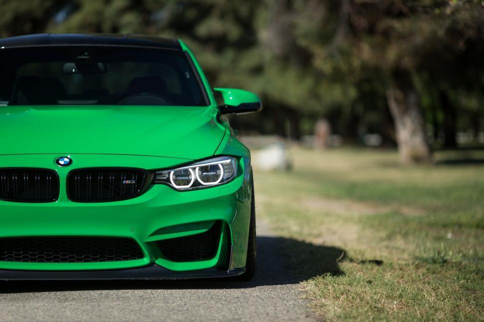 Free Image of Green Car Parked on Side of Road 
