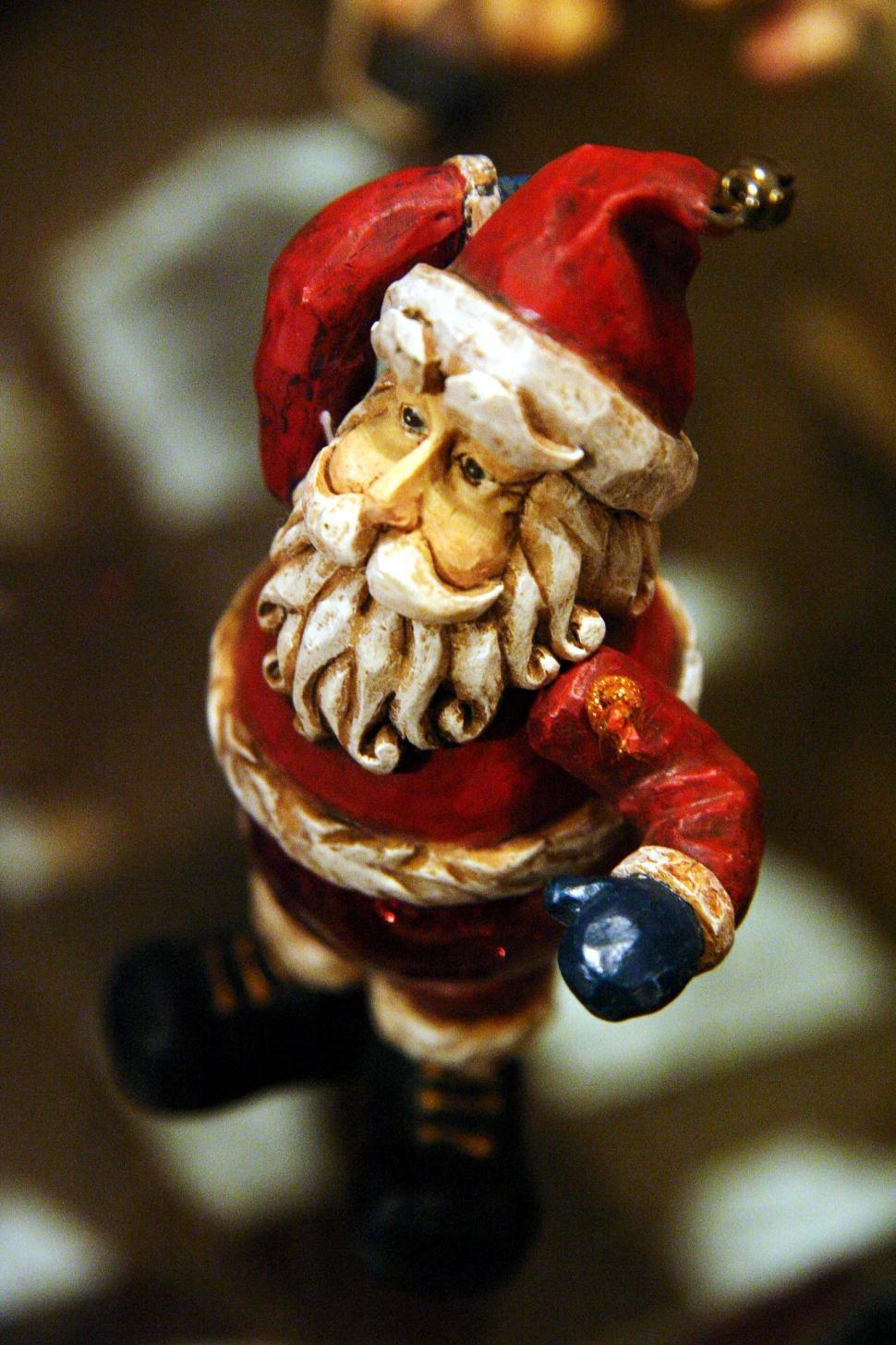 Free Image of Santa Claus Figurine Holding Bell 