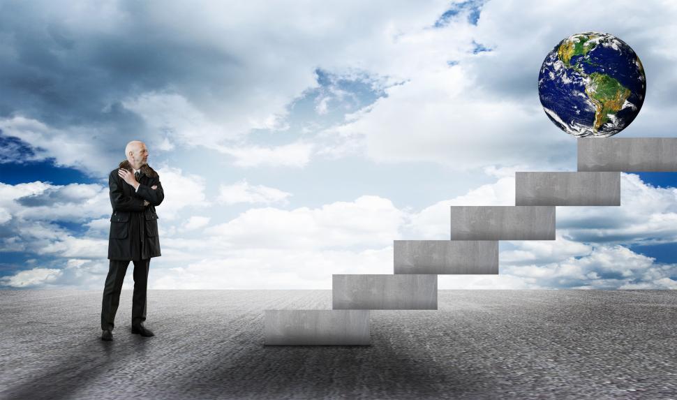 Free Image of Businessman facing stairs with Earth globe 