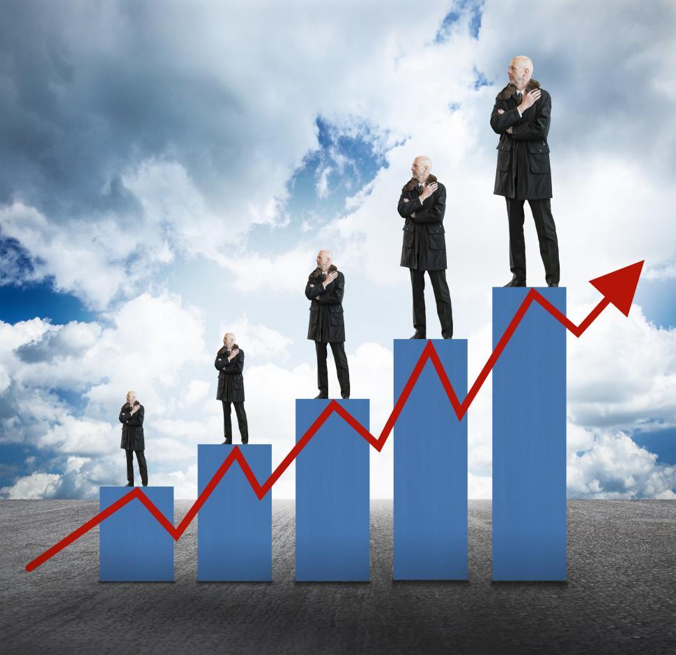 Free Image of Capital Appreciation - Businessmen on Bar Char with Arrow 