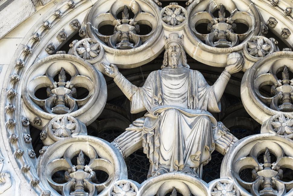 Free Image of Figure at cathedral window 