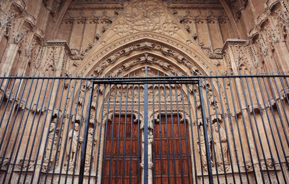 Free Image of Tall Building With Gate and Clock 
