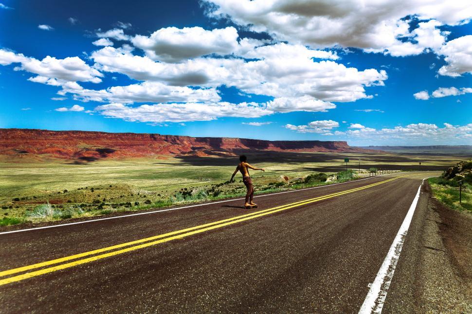 Free Image of Skateboarding on the open road 