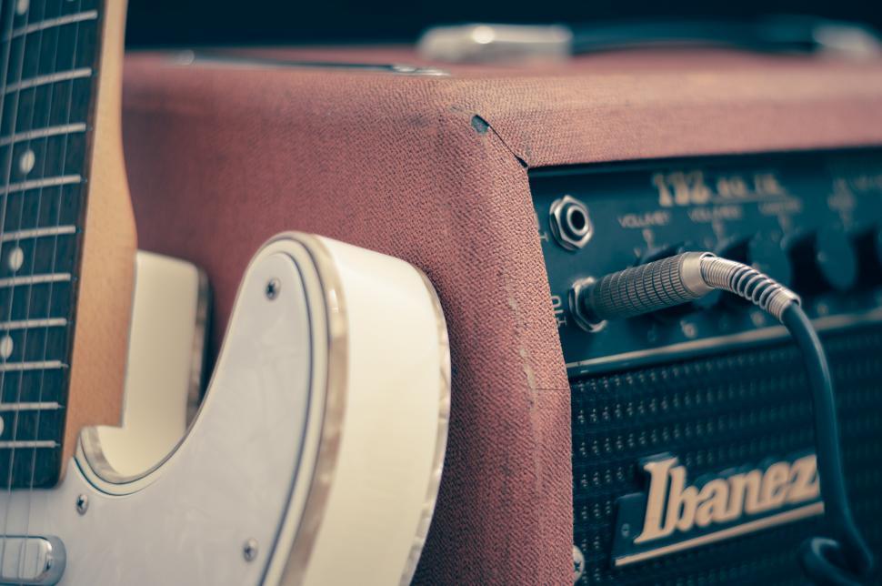 Free Image of Electric guitar plugged in 