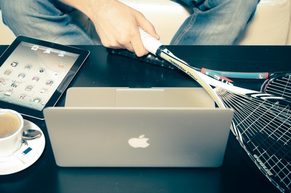 Free Image of Laptop and squash racquets  
