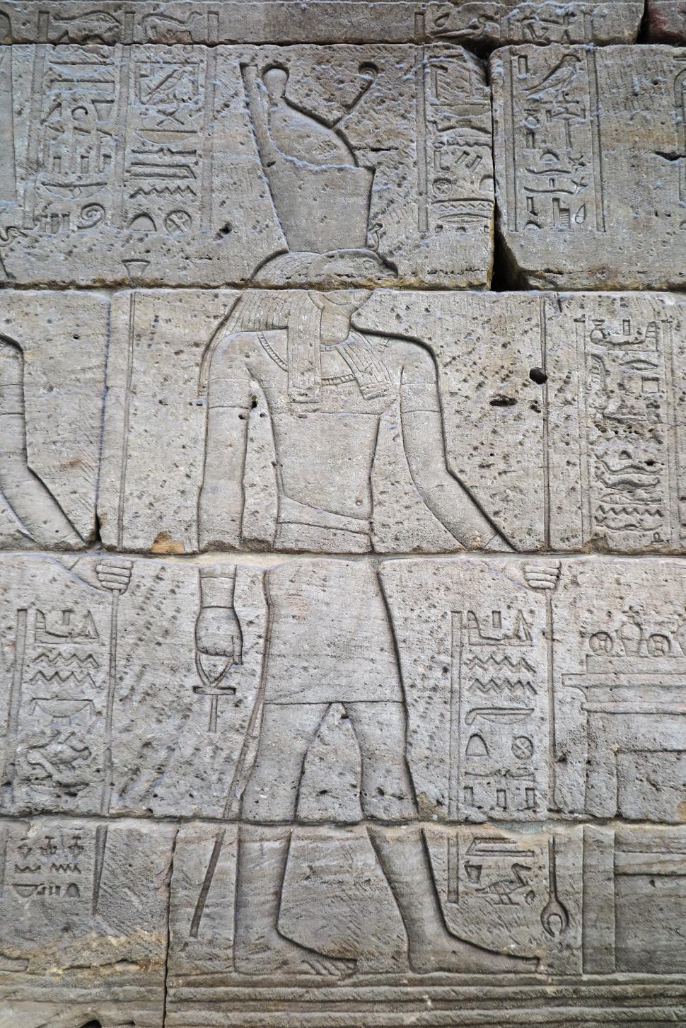 Free Image of Heiroglyphics and figures carved 