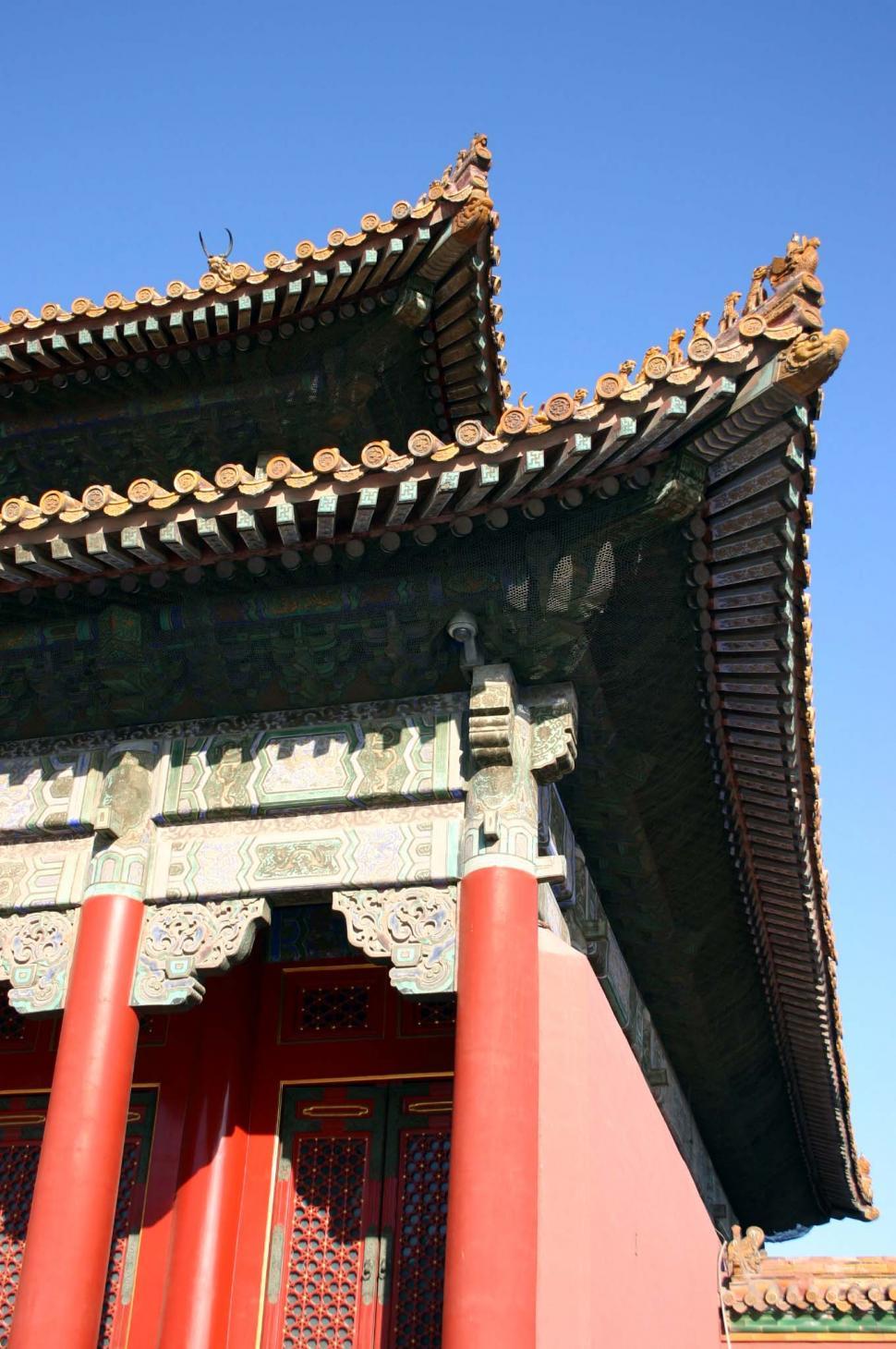 Free Image of Tall Building With Red Pillars 