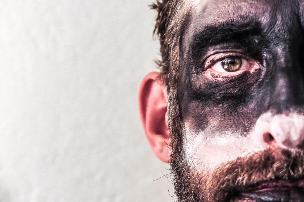 Free Image of Man in dark makeup 