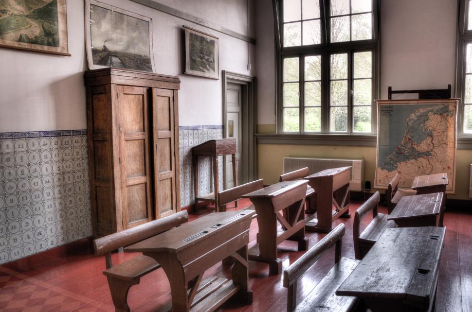 Free Image of Room Filled With Wooden Benches 