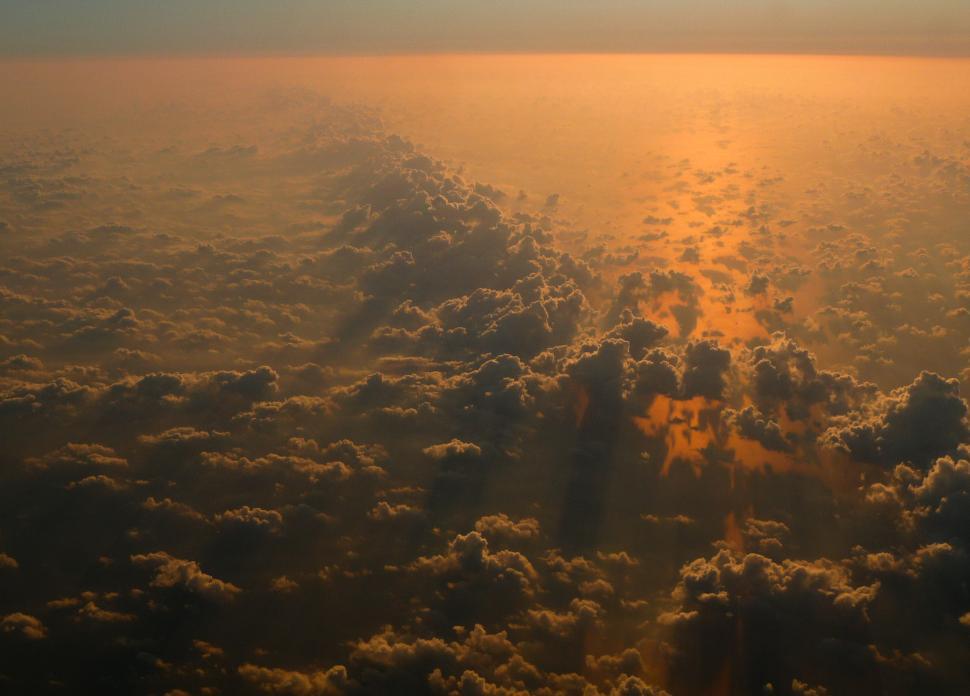 Free Image of Sun Shining Through Clouds in Sky 