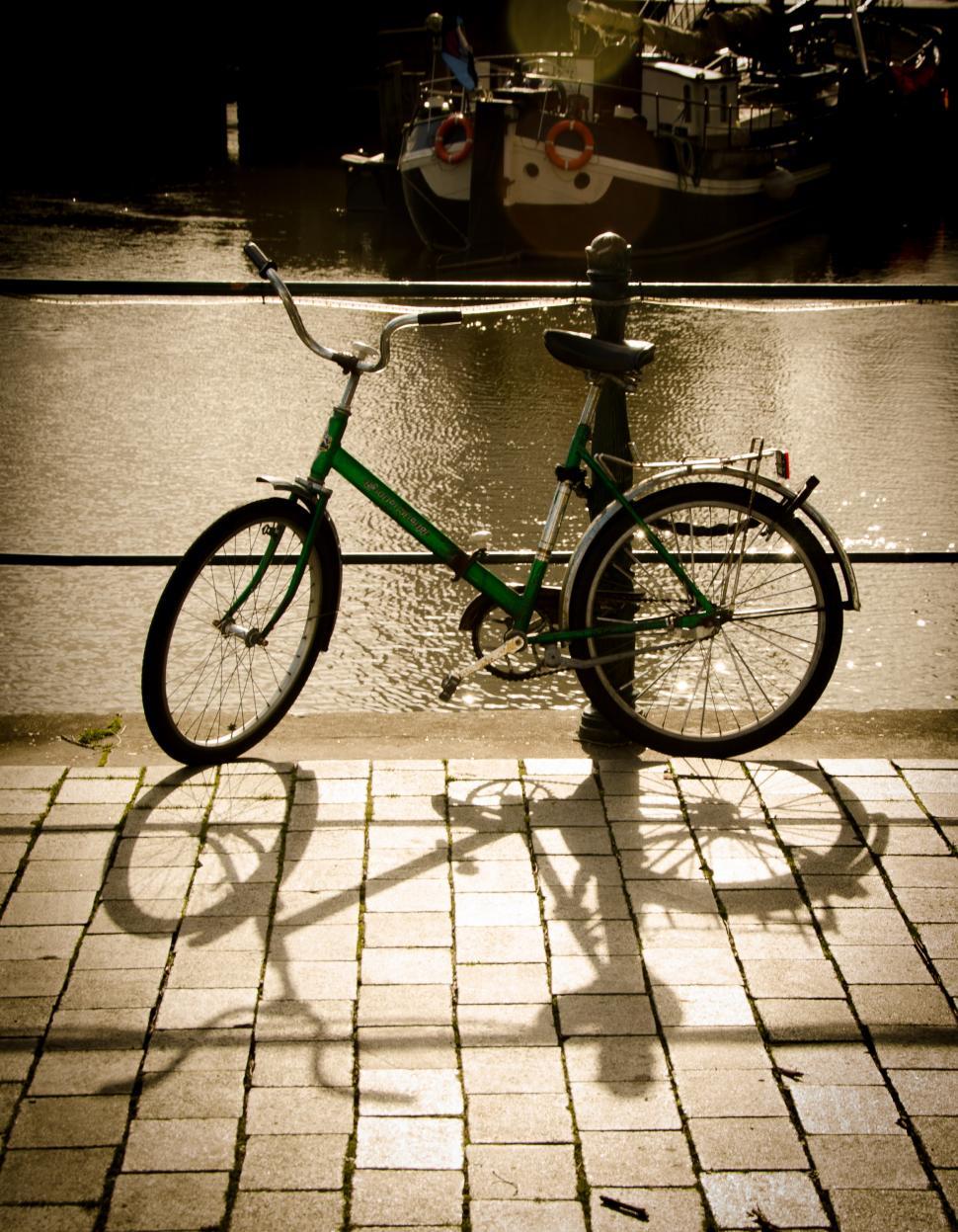 Free Image of Bike Parked Next to Fire Hydrant on Sidewalk 