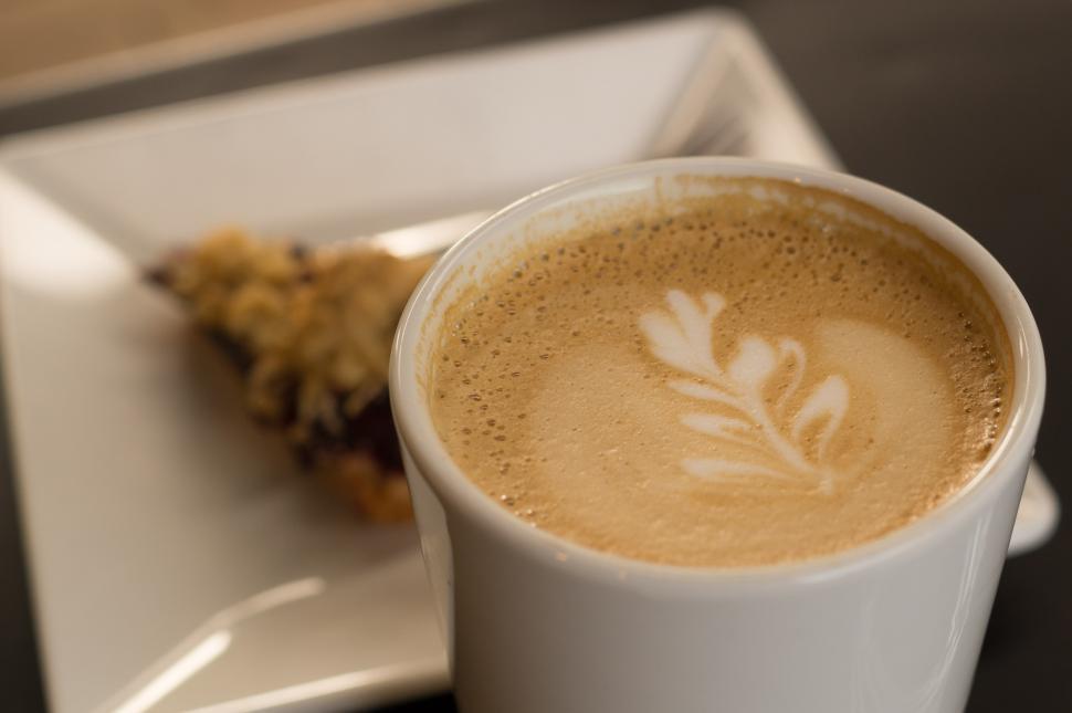 Free Image of A Cup of Coffee and a Pastry on a Plate 