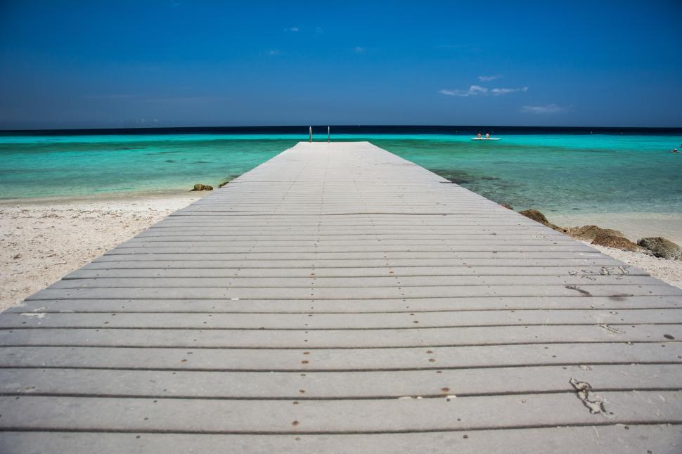 Free Image of Long Pier Extending Into the Ocean 