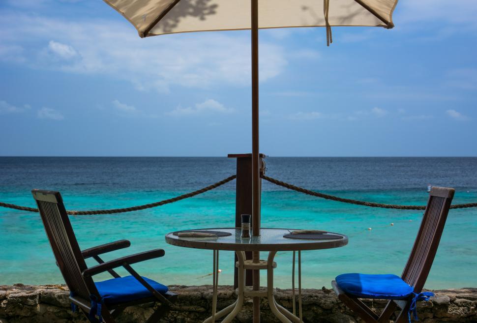 Free Image of Chairs Under Umbrella 