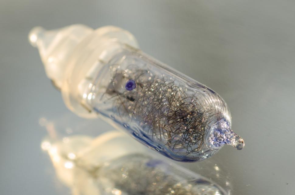Free Image of Close Up of Toothbrush With Silver Flakes 
