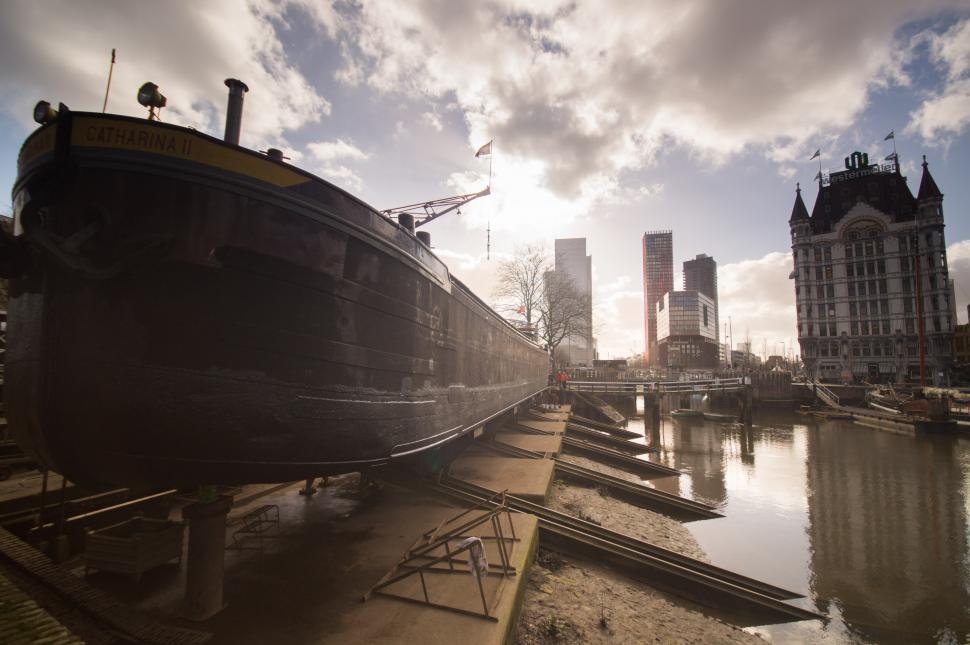 Free Image of Large Boat Resting on Body of Water 
