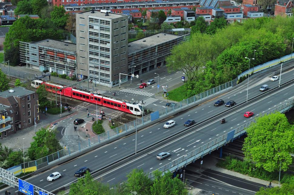 Free Image of Red and White Train Crossing Bridge 