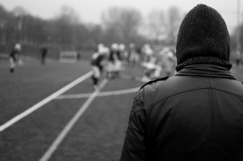 Free Image of Observing Soccer Match in Black and White 