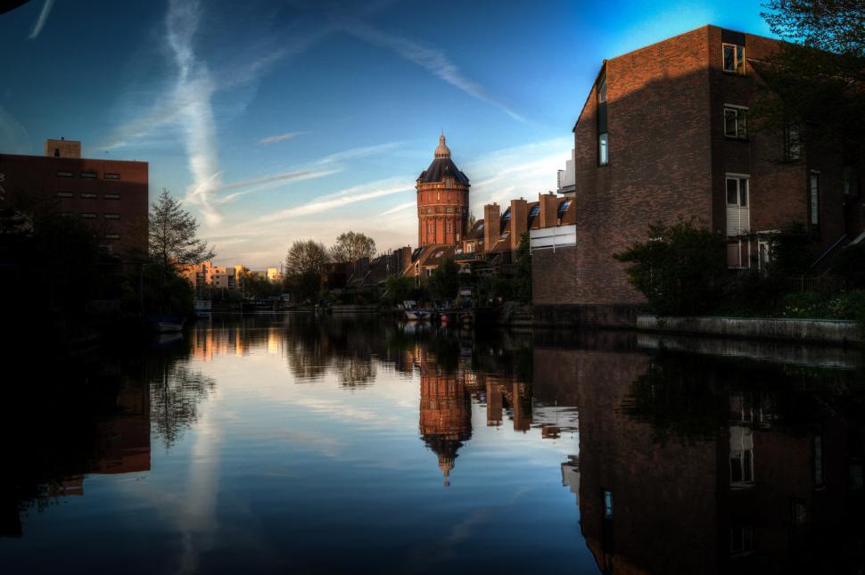 Free Image of Clock Tower Overlooking Large Body of Water 