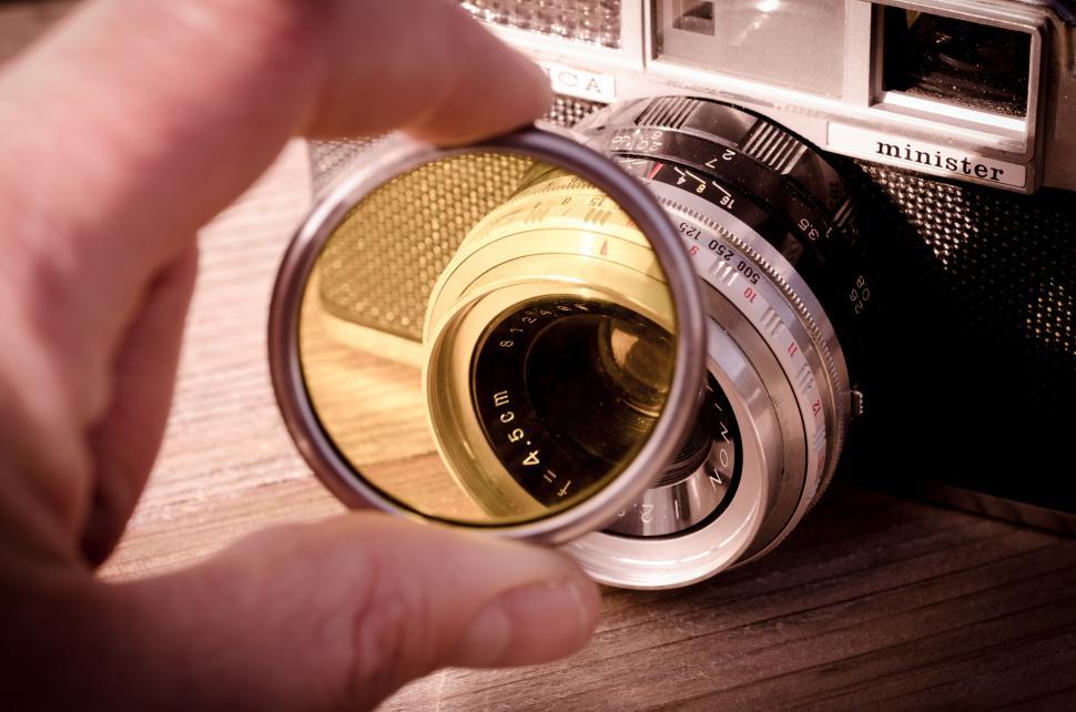 Free Image of Person Holding Camera in Front of Mirror 