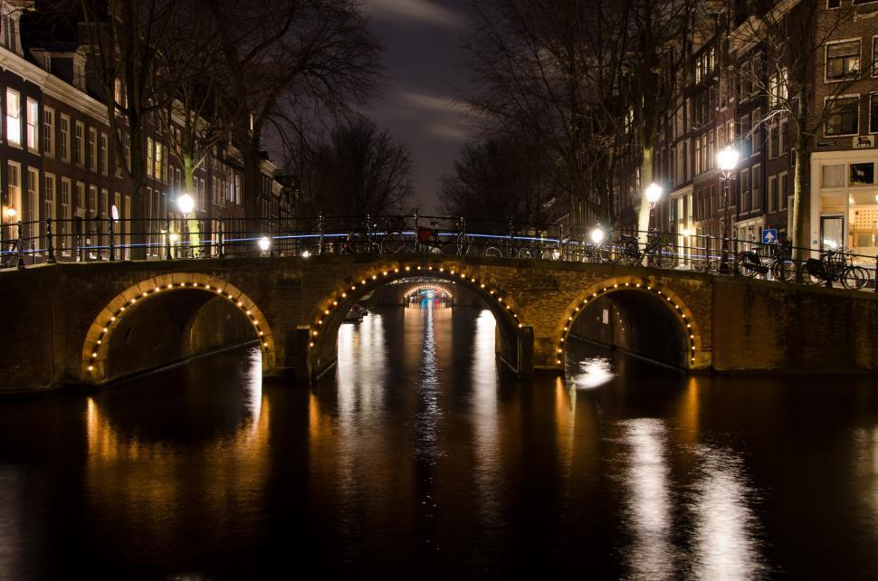 Free Image of Bridge Over Body of Water at Night 