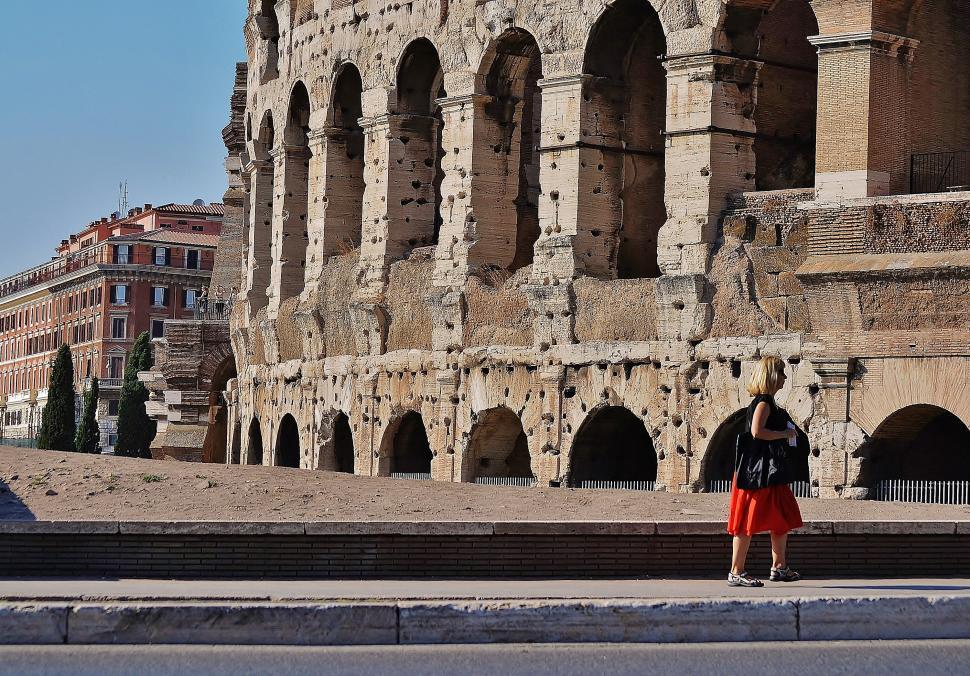Free Image of Man Standing in Front of Old Building 