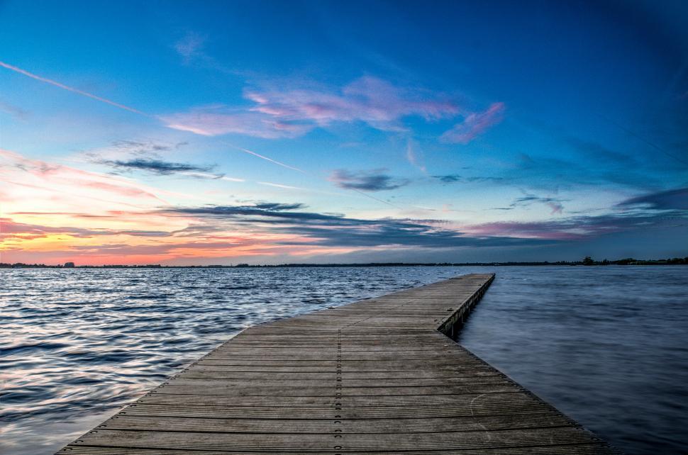 Free Image of Wooden Dock Overlooking Body of Water 