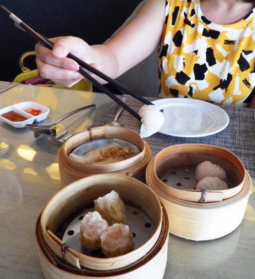 Free Image of Eating Dim Sum with Chopsticks   