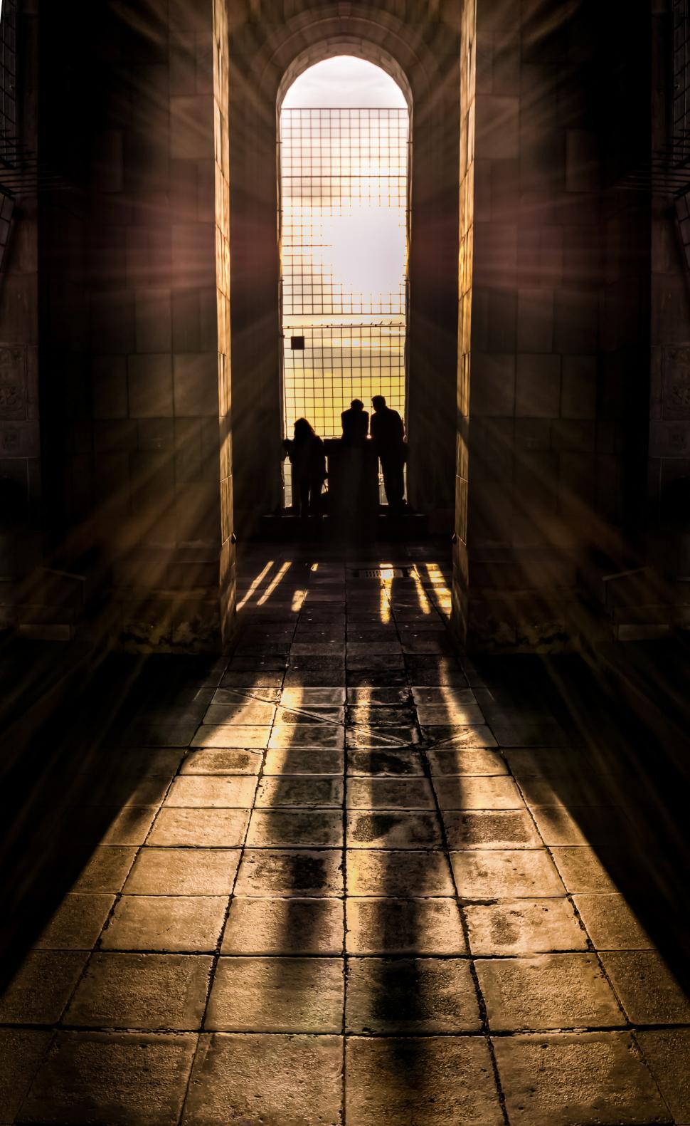 Free Image of Group of People Standing in Tunnel 