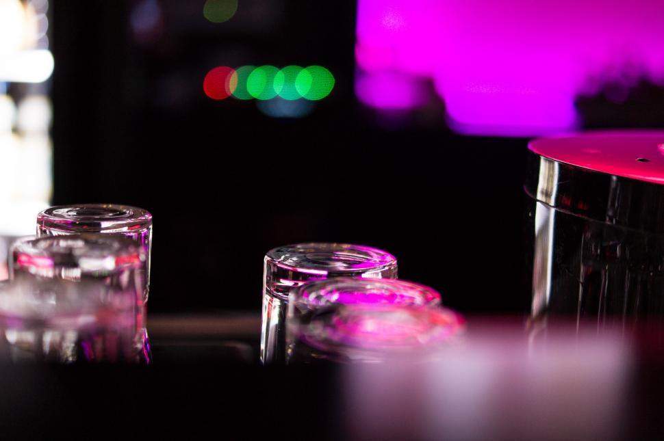 Free Image of Three Glass Containers Filled With Liquid on Table 