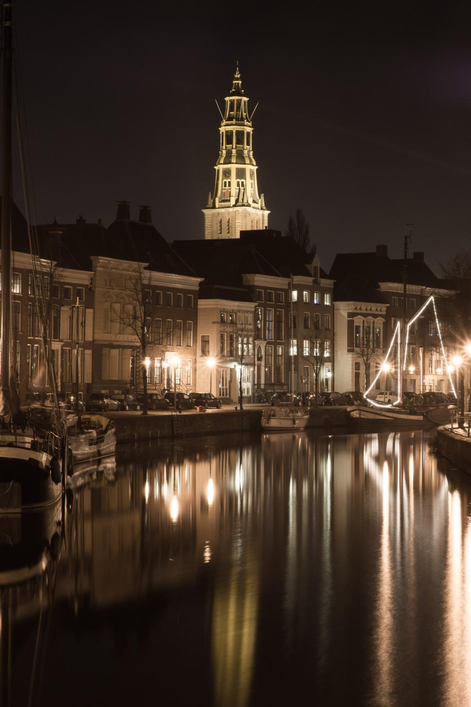 Free Image of City Night View With Docked Boats 
