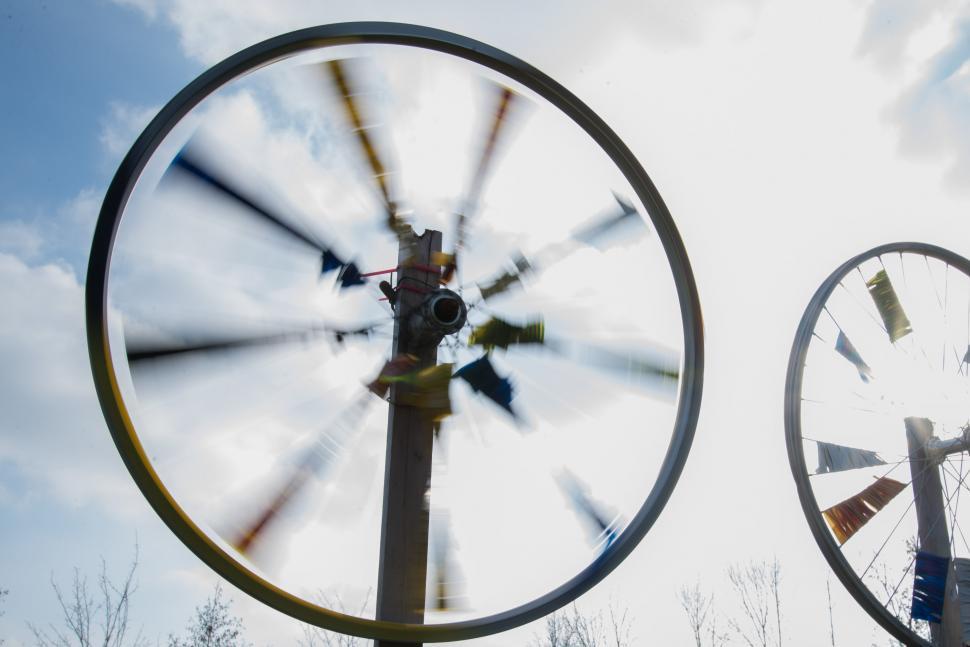 Free Image of Two Windmills Standing Side by Side 