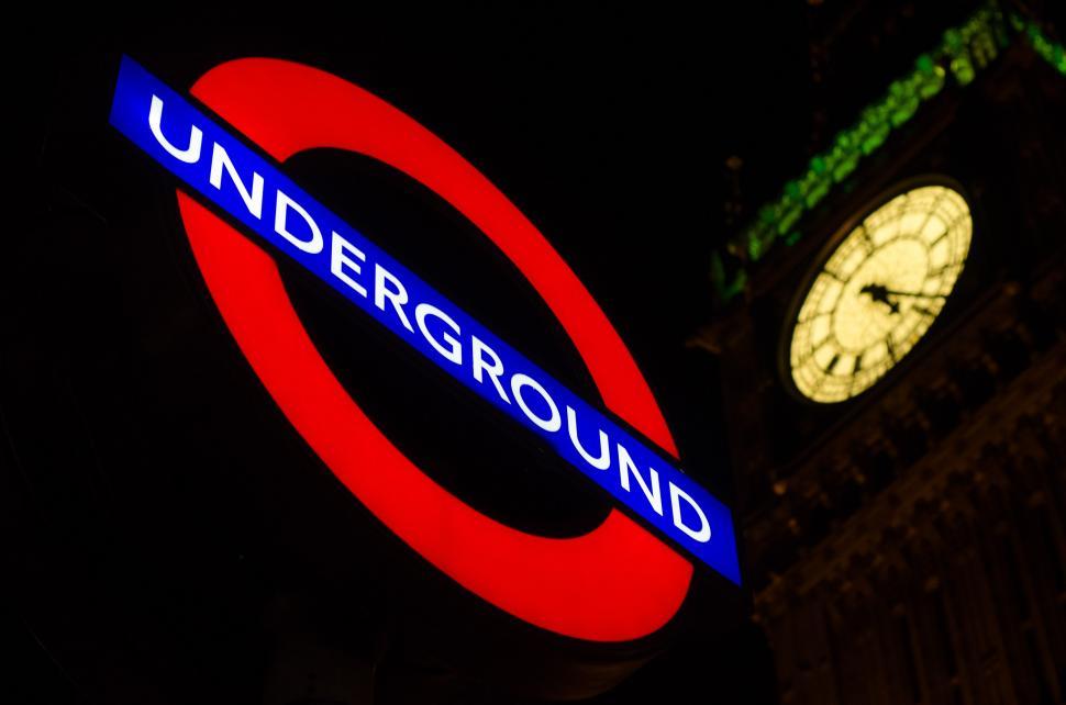 Free Image of Clock Tower With Sign Underneath 