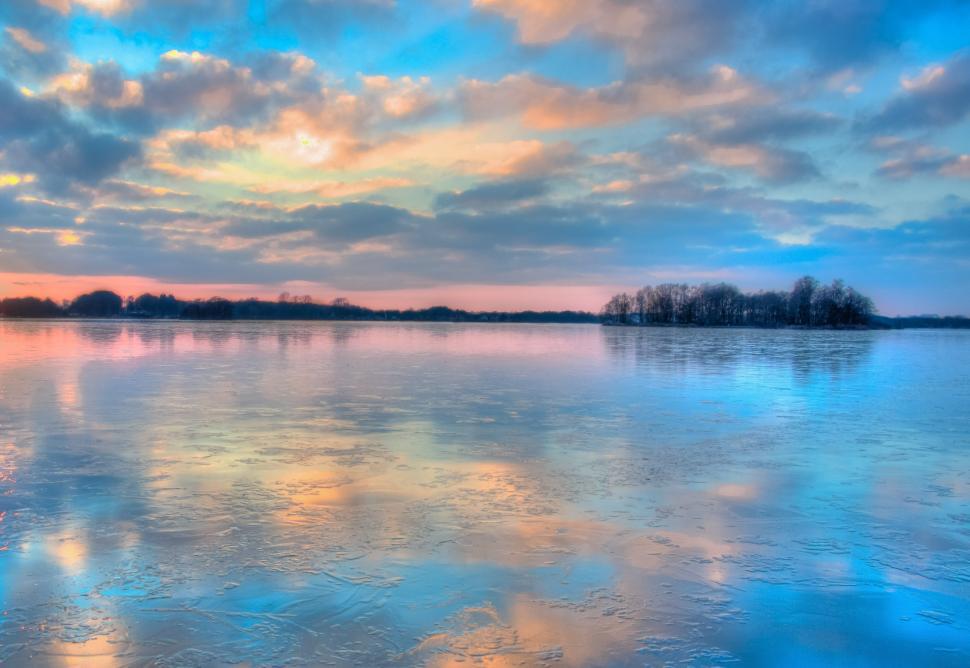 Free Image of Vast Water Body With Clouds in the Sky 