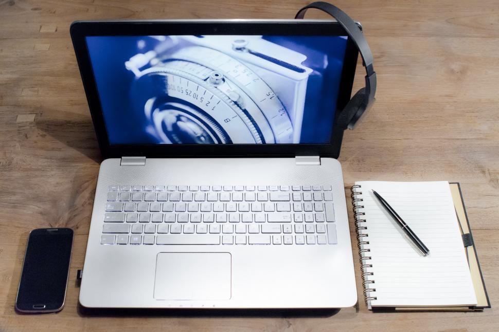 Free Image of Open Laptop Computer on Wooden Table 