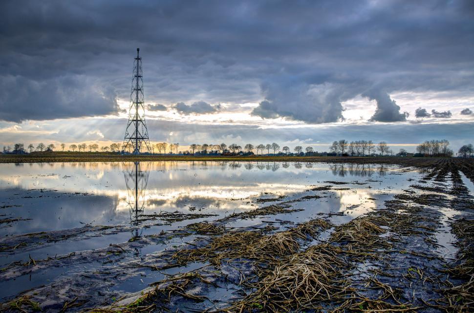 Free Image of Large Body of Water Under Cloudy Sky 